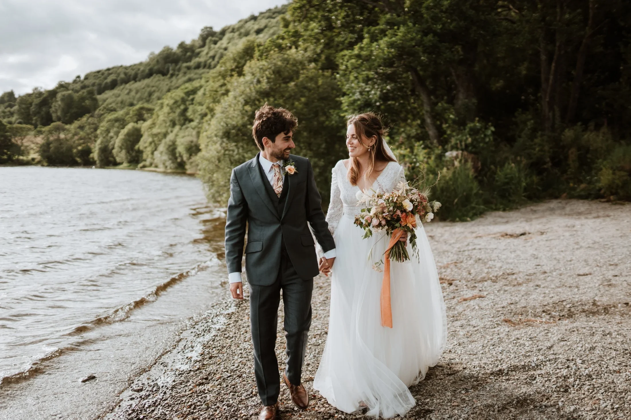 Outdoor wedding ceremony seating on the lawn at Venachar Lochside
