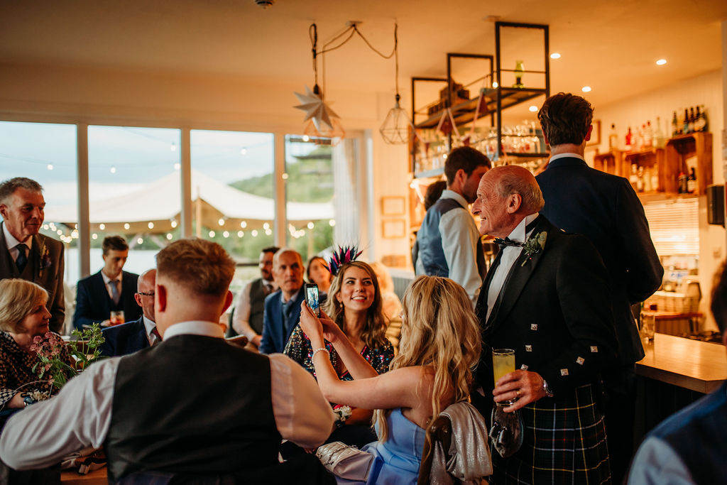 Guests gathered at the bar during the evening reception